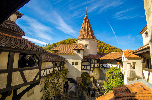 Bran, Romania - November 7, 2019: View of inside part of Bran or Dracula Castle in Transylvania, Romania. Tower of medieval Bran Castelul with tourists during the tour.