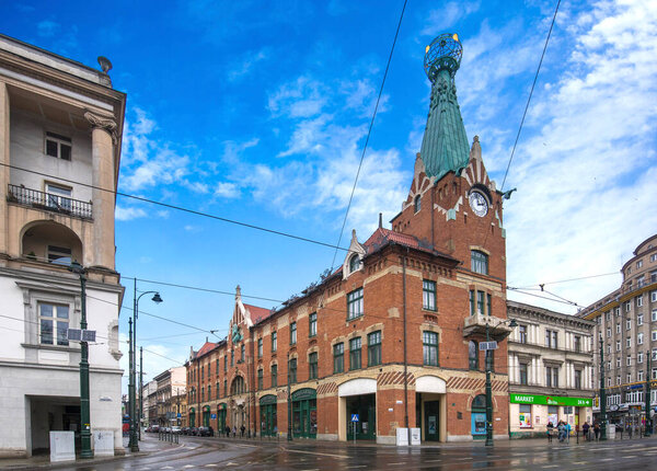 Krakow, Poland - April 25, 2019: The house under the Globe (Dom Pod Globusem) and one of the oldest bookstore in Poland - Ksiegarnia Pod Globusem. Tadeusz Stryjenski and Franciszek Maczynski design.