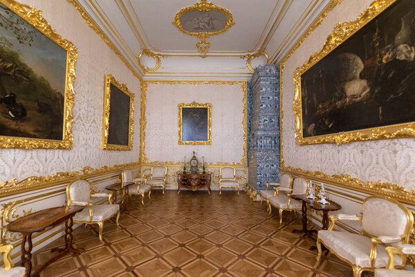 Tsarskoye Selo (Pushkin), Saint Petersburg, Russia - 28 November, 2019:  Baroque golden interior of The Catherine Palace, located in the town of Tsarskoe selo. Russian residence of Romanov Tsars