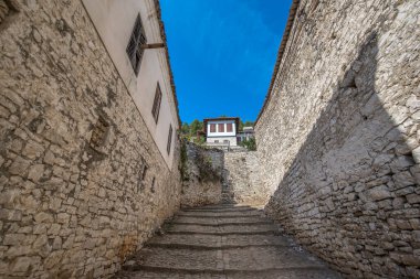 Historic city. Traditional ottoman houses in Berat old town (mangalem district) in Albania . listed as UNESCO world heritage site, along with river Osum bank. thousand windows city clipart