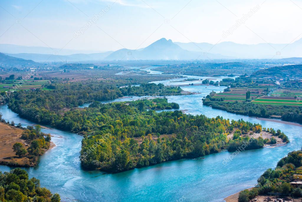Aerial panorama view of the Buna River after the confluence with the Drin River from Rozafa Castle, Shkoder, Albania. Meandres and mountain. Beautiful Landscape
