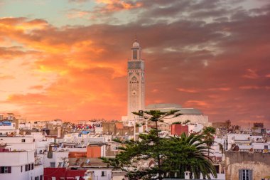 The Hassan II Mosque at sunset in Casablanca, Morocco. Is the largest mosque in Morocco and one of the most beautiful. the 13th largest in the world. Aerial shot view after the blue hour clipart