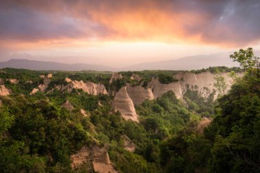Panorama of the sand pyramids of Melnik, Bulgaria at sunset. Beautiful mountain landscape at spring. clipart