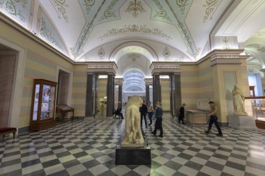 Saint Petersburg, Russia - 11 December, 2019: Interior of the Hermitage Russian state museum. Ancient statue and historical relics. Largest in the world clipart