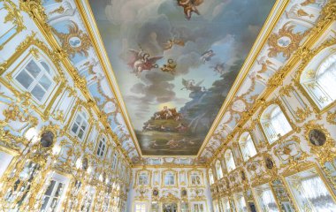 Peterhof Palace interior in Saint Petersburg, Russia, commissioned by Peter the Great. Amazing staircase, walls and ceiling decorated with baroque gold ornaments. Peterhof - 14.11.2019 clipart