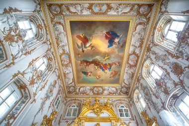 Peterhof Palace interior in Saint Petersburg, Russia, commissioned by Peter the Great. Amazing staircase, walls and ceiling decorated with baroque gold ornaments. Peterhof - 14.11.2019 clipart