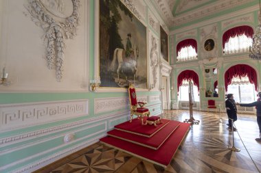 Peterhof Palace interior in Saint Petersburg, Russia, commissioned by Peter the Great. Amazing staircase, walls and ceiling decorated with baroque gold ornaments. Peterhof - 14.11.2019 clipart