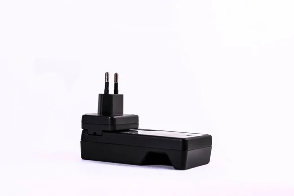 battery charger to charge the batteries into a black outlet