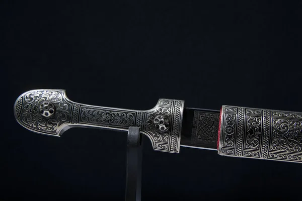 the dagger sword on a black background