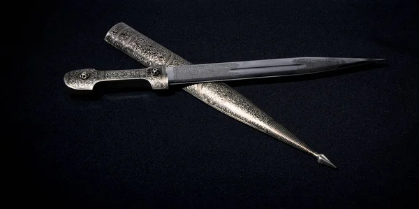 the dagger sword on a black background
