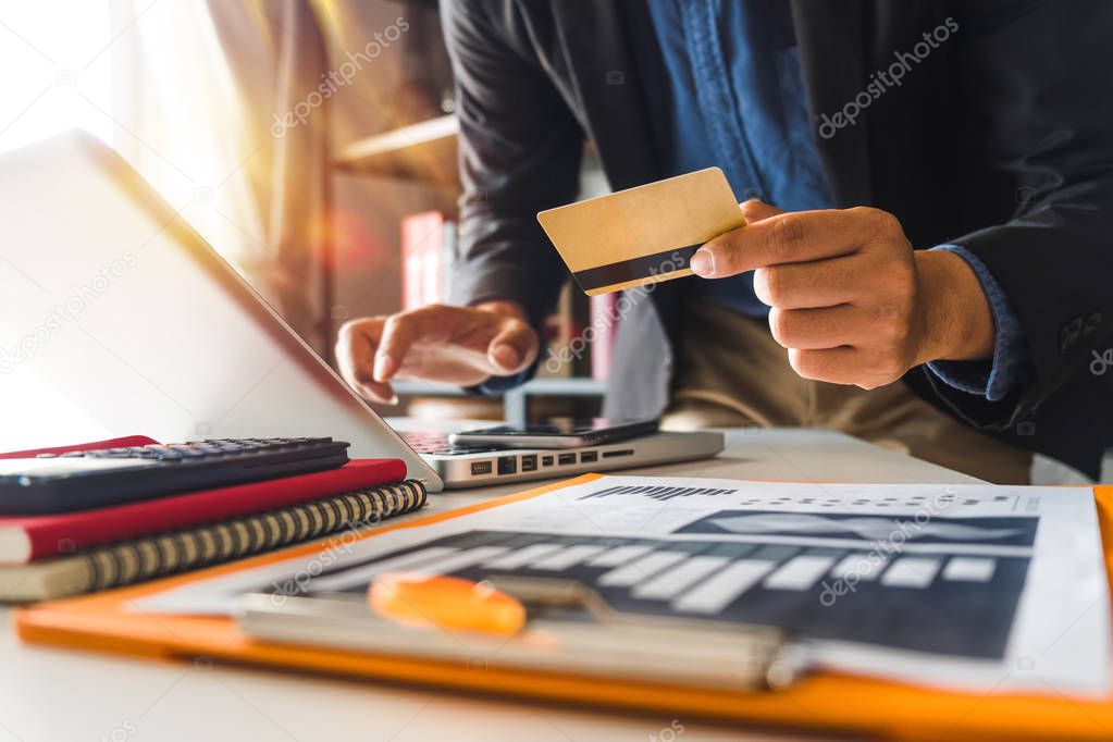Business man hands using smartphone and holding credit card with digital layer effect diagram as Online shopping concept