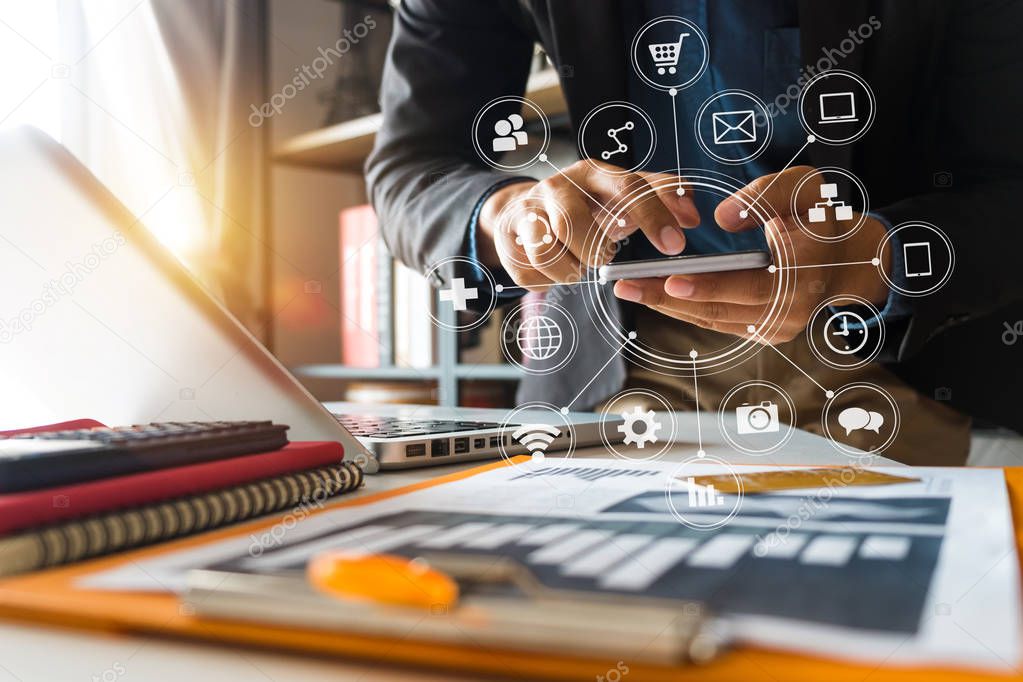  business man hand working with laptop computer, tablet and smart phone in modern office with virtual icon diagram at modern office in morning light 