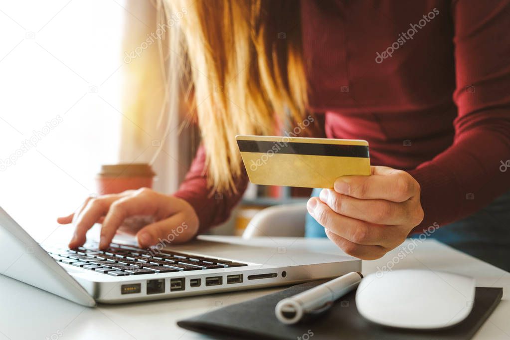 Business woman hands using smartphone and holding credit card with digital layer effect diagram as Online shopping concept