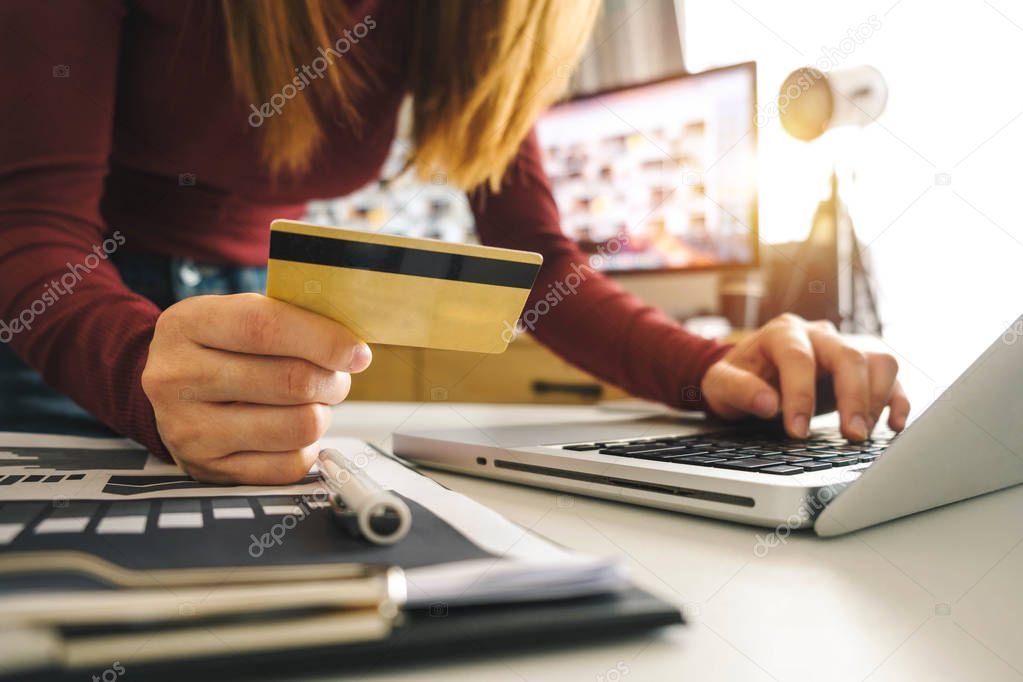 Business woman hands using smartphone and holding credit card with digital layer effect diagram as Online shopping concept