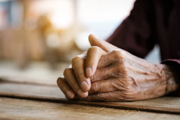 Hands Old Man Wood Table Vintage Tone — Stock Photo, Image