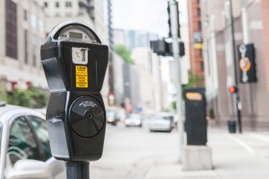 Close-up of a generic american parking meter in the streets of downtown chicago with large copy space, usa. clipart