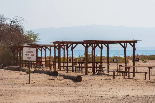 Abandoned park, rest and leisure area, in Salton Sea Beach ghost town in summer, California.