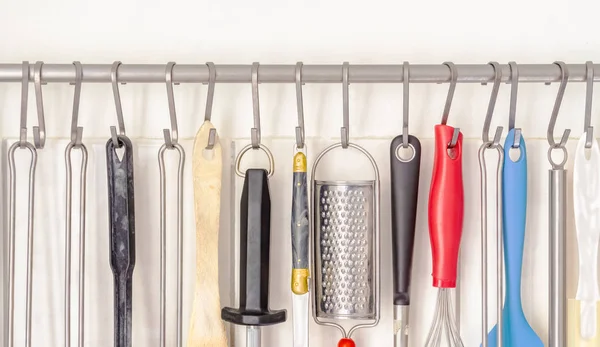 Many Different Kitchenware Hung White Kitchen Wall — Stock Photo, Image