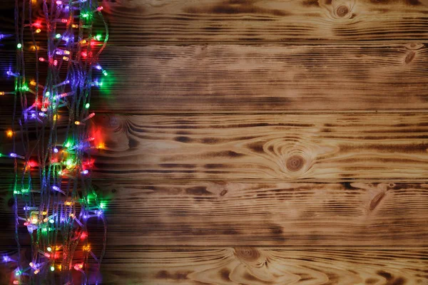Ahşap arka planda Noel ışıkları — Stok fotoğraf