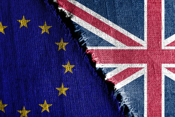 The gap between the two flags, Great Britain and European Union, as a concept of political confrontation or brexit.