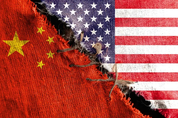 The gap between the two flags, the United States and China, as a concept of political confrontation.