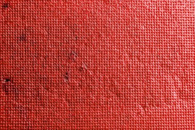 Çizikler ve sürtünmeler ile küçük kareler oluşan parlak kırmızı doku