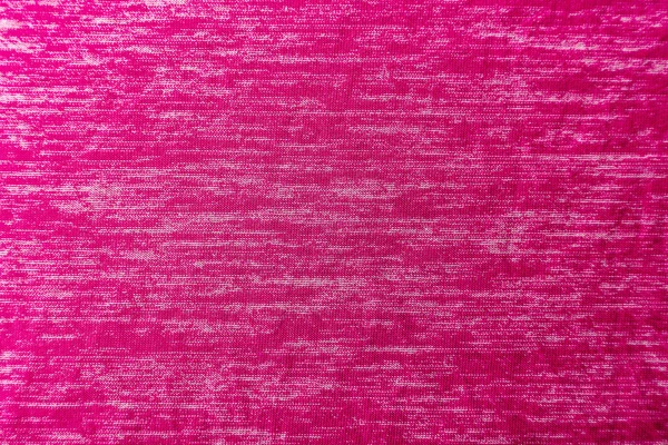 Une texture de tissu rose uniformément éclairée avec des ombres douces . — Photo