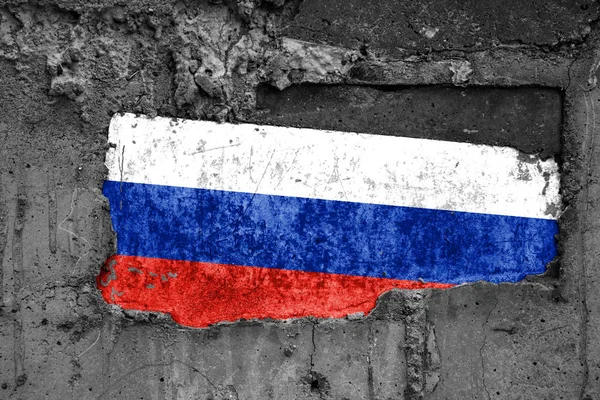 The flag of Russia on a dirty wooden surface, built into a concrete base, with scuffs and scratches. Loss or destruction conception.