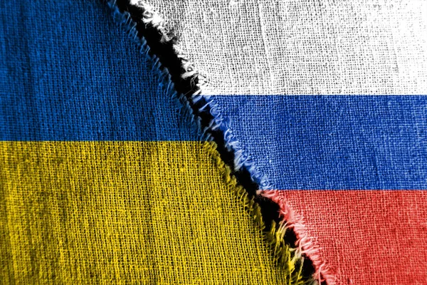The gap between the two flags, Russia and Ukraine, as a concept of political confrontation.