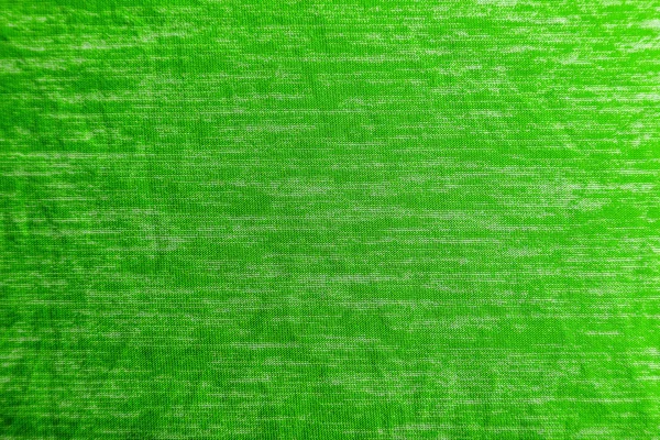 Uma textura de tecido verde uniformemente iluminada com sombras suaves . — Fotografia de Stock