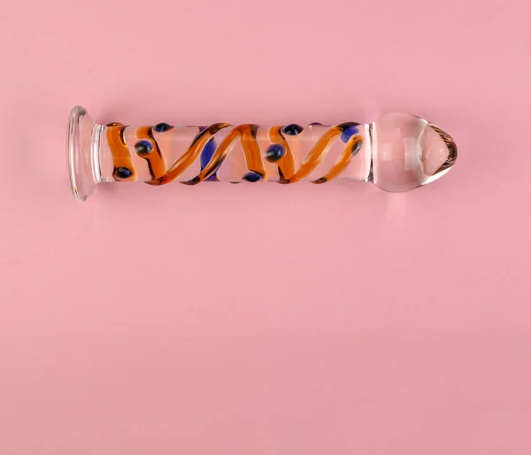 Beautiful evenly lit glass dildo on a plain pink background with copy space. — Stock Photo, Image
