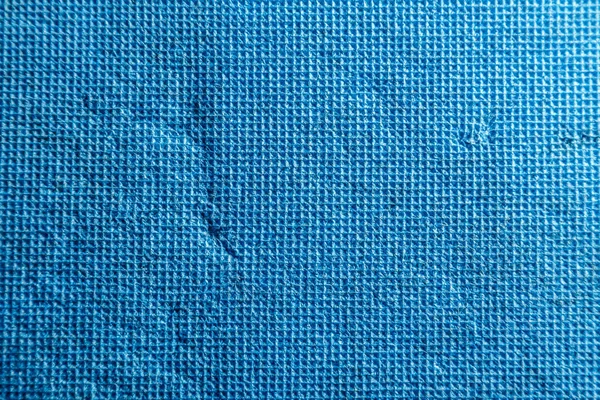 Bright blue texture consisting of small squares with scratches and scuffs — Stock Photo, Image