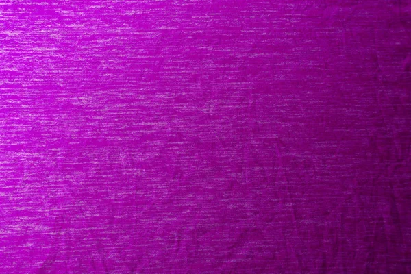 Egyenletesen megvilágított lila szövet textúrájú lágy árnyékokkal. — Stock Fotó