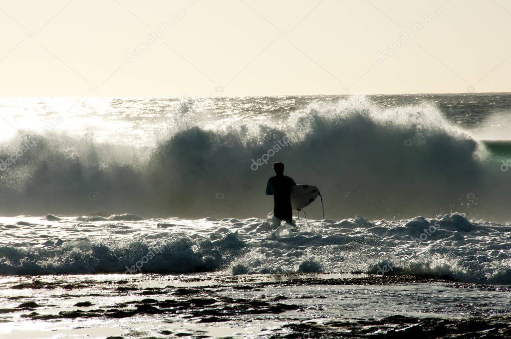 Surfer Silhouette in Ocean