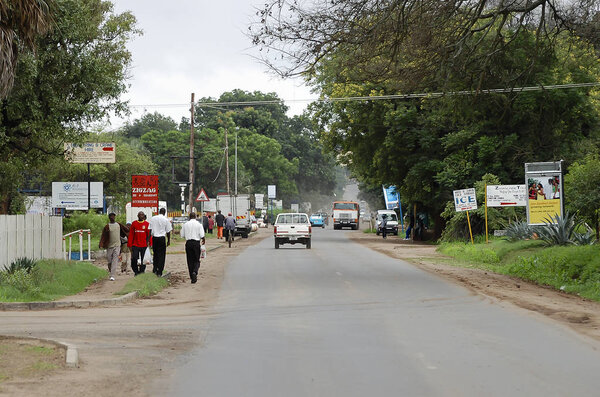 LIVINGSTONE, ZAMBIA - December 15, 2008: City life on T1 boulevard in the touristic city adjacent to Victoria Falls