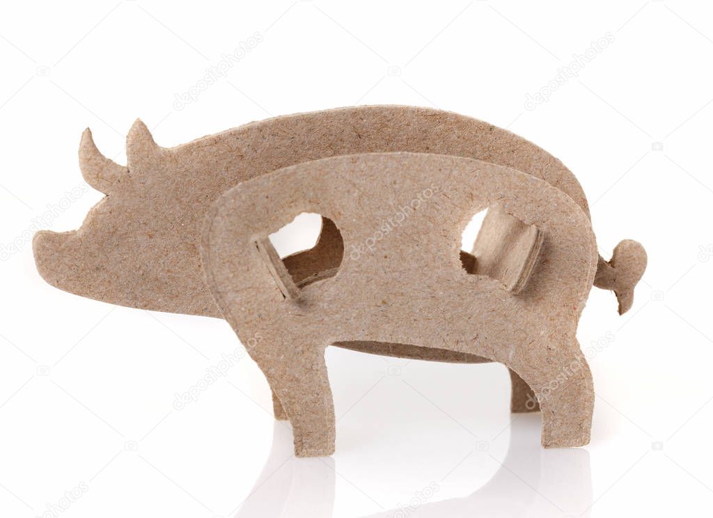 Cardboard toy pig, the symbol of the year on a white background