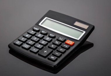 Gri arka plan üzerinde siyah eski eski stil hesap makinesi