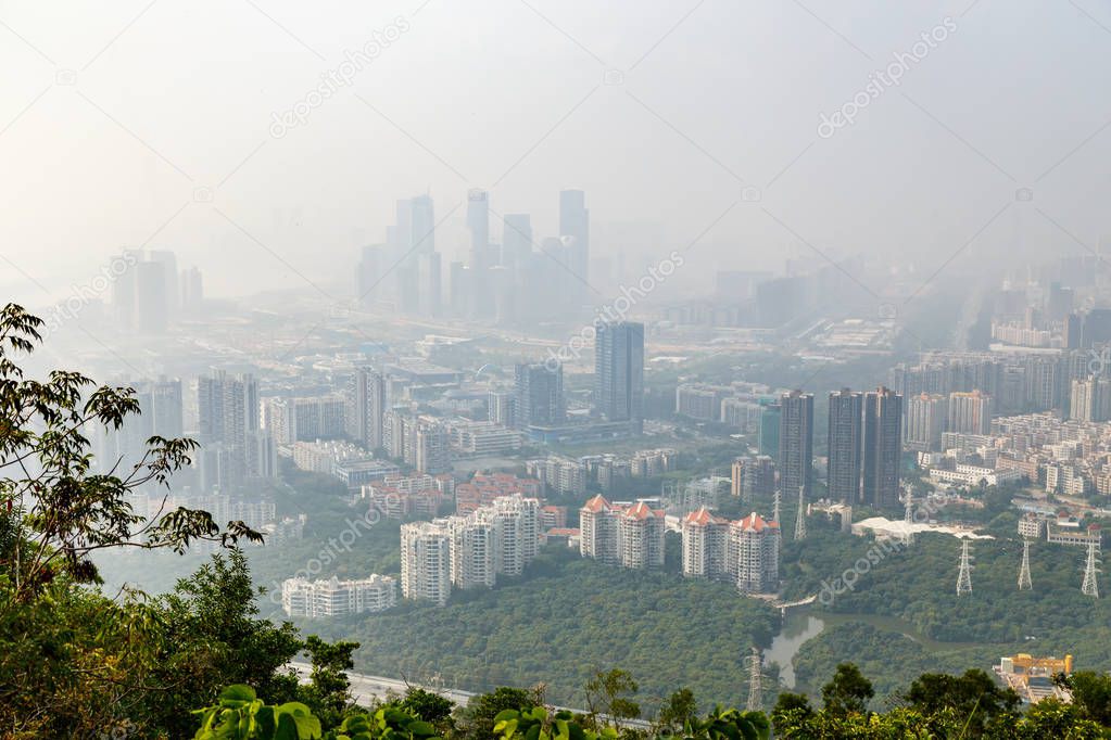 View of the foggy city from the mountain