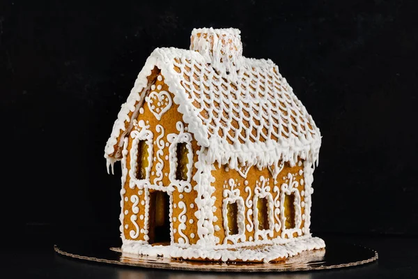 Gingerbread house on a dark background — Stock Photo, Image