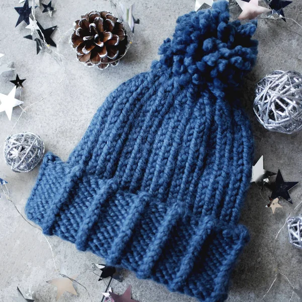 Knit Wool Hat with Pom Pom. Flat lay fashion winter background