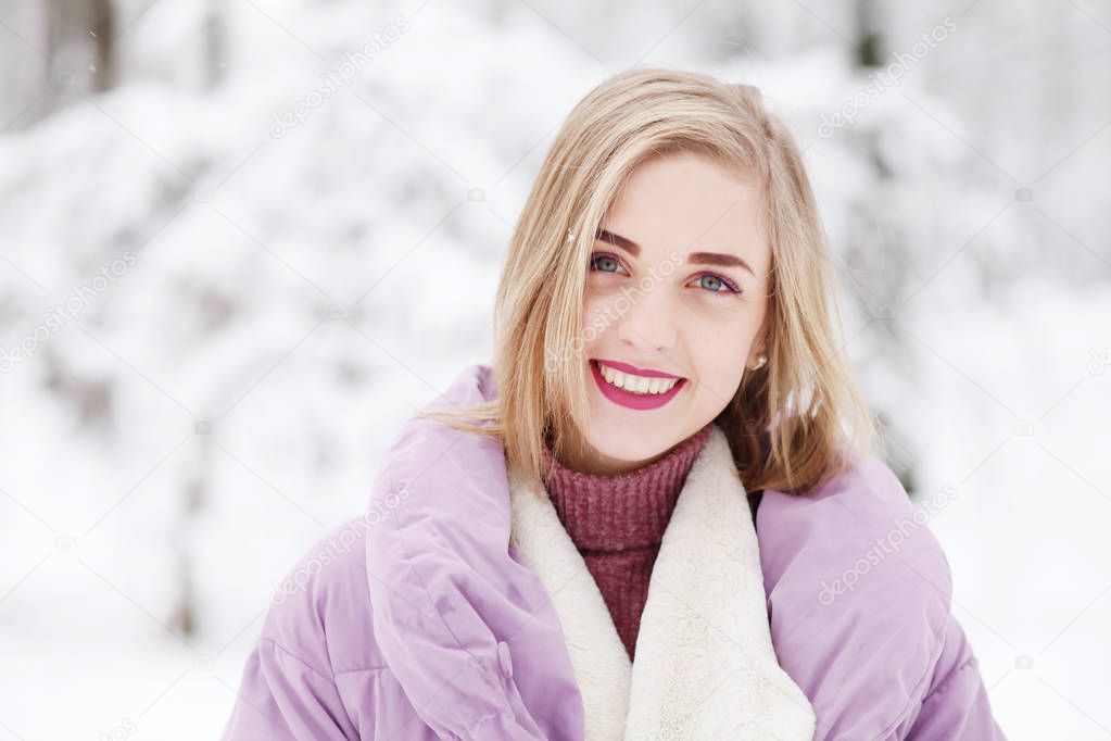 young happy woman posing in winter scene