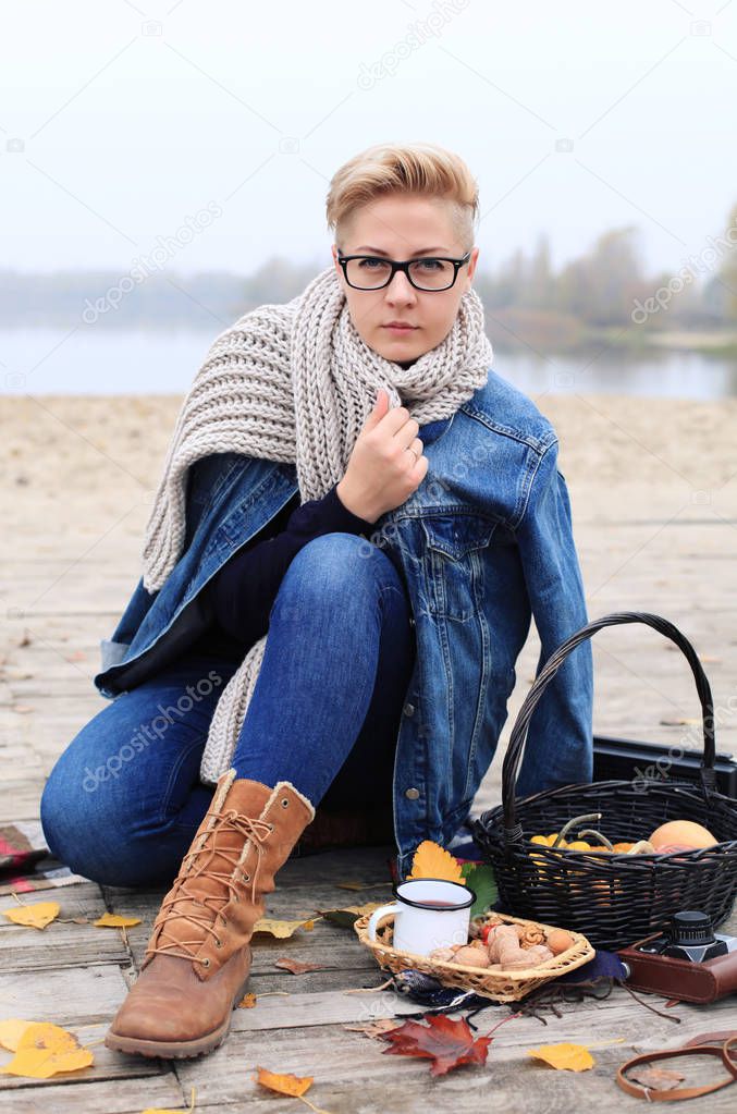 Androgynous Woman Wearing Denim Jacket at the Park