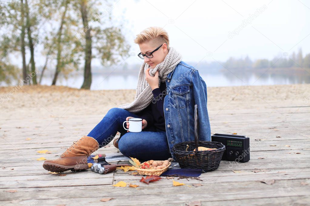Androgynous Woman Wearing Denim Jacket at the Park