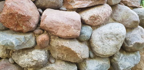 Arka plan ve inşa taş duvar dokusu büyük kayalardan yapılmış.