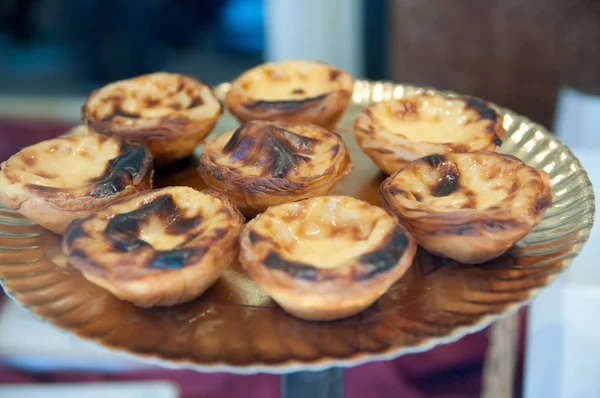 sweet cakes on glass plate, close-up