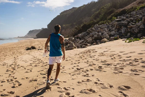 Back view of man walking on seashore, Bali, Indonesia — Stock Photo