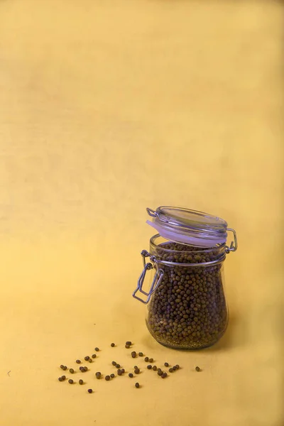 Mung bean in a jar on a yellow background. Copy spaes. Vertical — Stock Photo, Image