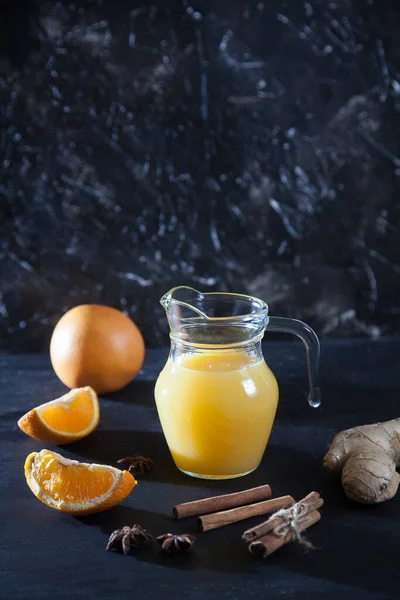 Ginger Orange Juice Glass Pitchers Oranges Ginger Cinnamon Black Background — Stock Photo, Image