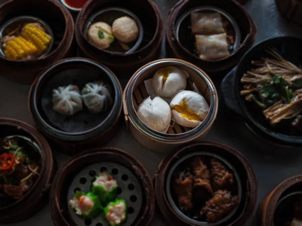 n selective of the steamed stuff bun,Chinese food ,Dimsum in bamboo basket.put on table ,