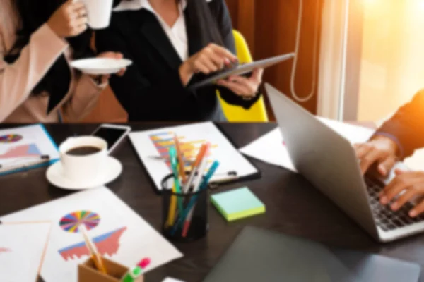 The blurry light design background of businessman and businesswoman meeting,the collaborator,working at office,warm light tone,